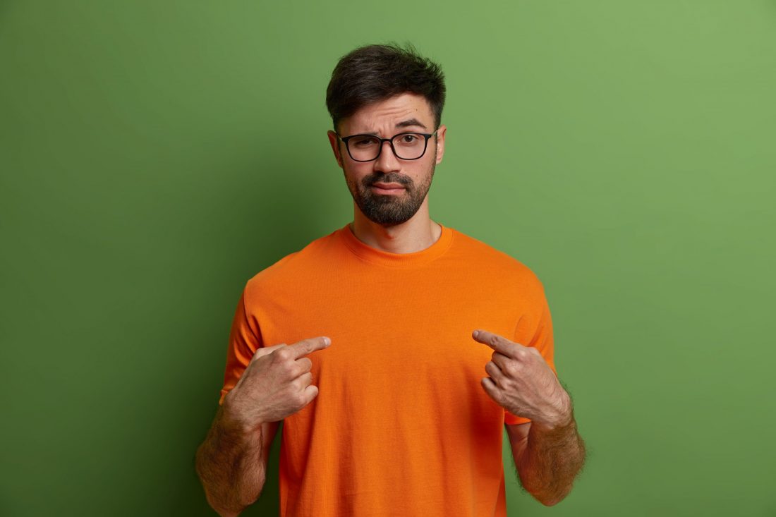 self confident man man pointing at himself with inquisitive look